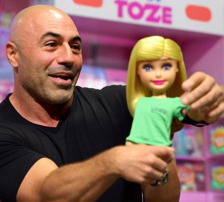 <lora:Joe Rogan - Trigger w Joerogan Person:.7>joerogan person buying a barbie doll at toys r us.