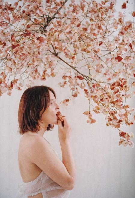 Model photography, the 1990s, bacon, a tree with bacon leaves, beautiful, in a white room, beautiful bacon blossom tree, white lighting, film grain, DSLR