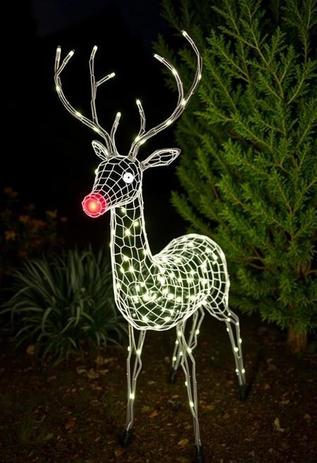 night time backyard garden, a sculpture of a deer made entirely out of hex chicken wire and Christmas lights, red glowing nose, some bushes and moths in the background