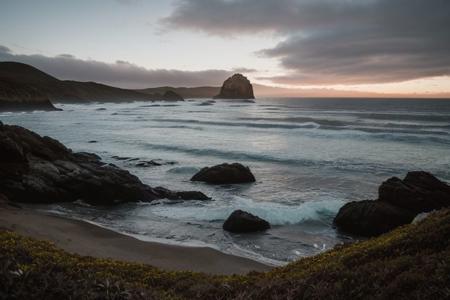 raw photo, a sunset landscape, Valdivian temperate forests coast, Chilean coast,  cozy, photorealistic, high detailed texture, 8k uhd, dslr, soft lighting, high quality, film grain, Fujifilm XT3, Sony A7 IV, highly detailed photography, (muted colors, cinematic, dim colors, soothing tones:1.2), vibrant, insanely detailed, hyperdetailed, (dark shot:1.2), (vsco:0.3), (intricate details:0.9), (hdr, hyperdetailed:1.2) (highest coherency: 1.39) (highest quality: 1.39) (rule of Thirds) (award winning) (breathtaking) (masterclass) (Playa Punta de Lobos)