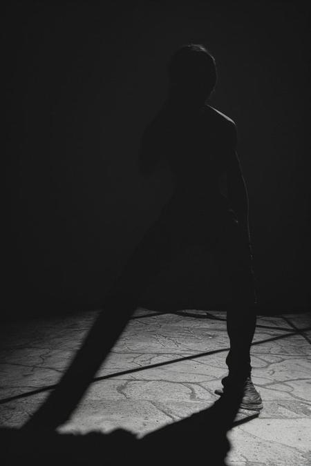 cinematic dark photo of (depraved, terrifying, and psychologically disturbing),  blackmagick, creeping towards camera, (low key lighting:1.2), (shadows:1.6), dutch angle, lit from below, dimly lit wide angle fisheye camera lens, action scene, foreshortening, surreal