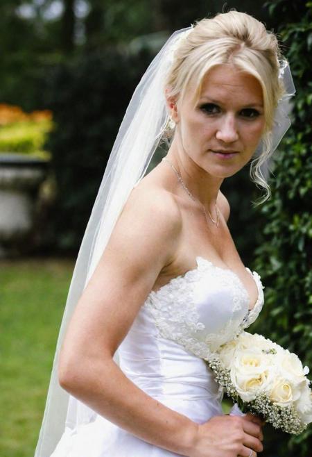beautiful blond bride, flowers, wedding dress, outdoor wedding photography, downblouse, nipple slip