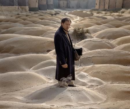 a man standing on mound of sand, by_andrei_tarkovsky, <lora:Andrei_Tarkovsky_Style-20 (1):1>