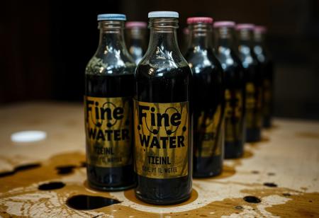 "Fine Bottled Water" Toxic Sludge, Black, thick, slimy, oily, greasy liquid in bottles