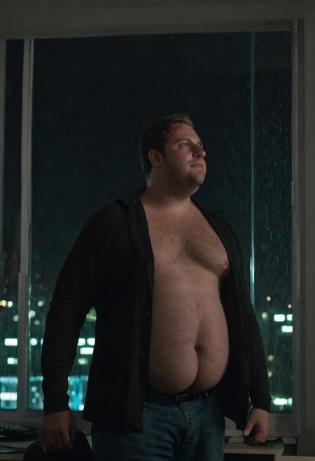 (((seen from below, pov below, sex pov, gay chubby porn))), ((cinematic hazey atmosphere, romantic movie, romance film, arthouse film)), ((dark, night nighttime, dark background, shadows)), Tanned chubby 30 year old bavarian man, wearing a black muscleshirt and blue jeans, light brown-blonde messy hair, stubble, doublechin, broad face, blue green eyes, big fat arms, big neck, broad neck, big belly, (nerd, programmer, coder), gentle smile, (standing near a window in dark office at night while looking outside, rainy night),