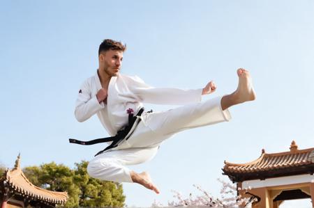 jusiki, side view, Loïc Barcourt a young man doing a jump sidekick in front of a pagoda. the man wears white karate uniform, black belt, [cherry blossom:0.25], detailed hands, toes, feet,
<lora:Rythmind_Loïc Barcourt_v4Final_hash:1> <lora:JumpedSideKick.0.9:1:lbw=0.18,0.5,0.5,0,0.8,1,1,1.1,1,1,0,0>, natural lighting, 4k, high quality, Fujifilm XT3