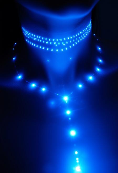 subdermal LED cascade necklace, (internal LED glow:1.7), (embedded LEDs:1.7) forming a cascading, layered pattern of glowing light beneath the skin, (delicate light strands:1.7) flowing down from the collarbone, mimicking the elegance of a waterfall necklace, soft light radiating from the top downwards, (layered light effect:1.6), high-definition, (natural skin tone:1.5), (ultra-realistic skin textures:1.8), smooth, graceful transitions of light following the neck’s natural contours, (no visible jewelry:1.8), (chains:-1.8), (rigid design:-1.5), glowing cascade effect under the skin, timeless, elegant, and perfect for formal occasions