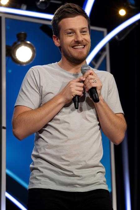 ChrisRamsey, holding a microphone, standup comedy <lora:rs-ChrisRamseyLora-05:1>