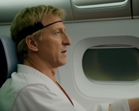 Johnnylawrence person <lora:JohnnyLawrence-Lora:.8> doing advanced karate kicks on a commercial airline flight. Photorealistic.