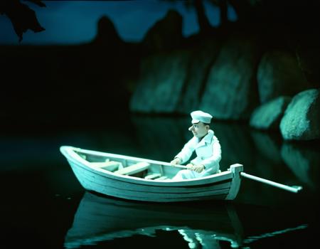 soviet cartoon, style of zyablikova, puppet, stopmotion, stop motion, a man in a white outfit is in a boat, night, intricate, highly detailed, digital painting, concept art, smooth, sharp, focus, illustration <lora:zyablikova_style:.05>