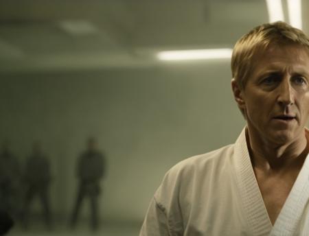 Johnnylawrence person <lora:JohnnyLawrence-Lora:.8> in a movie still from Prometheus 2012. cyborg aliens have been created, and after being born as humans, their minds are replaced with machine bodies. johnnylawrence person is the only man with the karate skills to beat down the cyborg aliens, fight scene, karate, action sequence, directed by Gareth Edwards