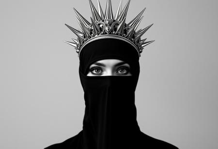 symmetrical front view of a lady in black veils her face and has a large silver spiked crown, in the style of celestial fashion, otherworldly beauty, davide sorrenti, celestial punk, album covers, fra angelico, aykut aydogdu, queencore, golden age aesthetics, black and white photography