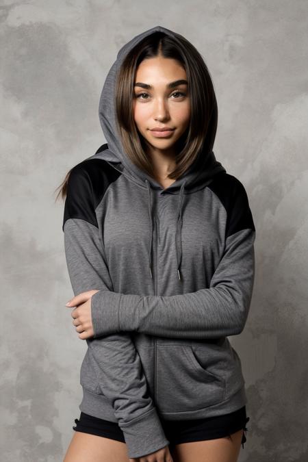 chantel_jeffries wearing grey hoodie, long brown hair, hazel eyes, 
upper body, portrait, wall background, 
 <lora:Chantel_Jeffries_V1.2:0.8>