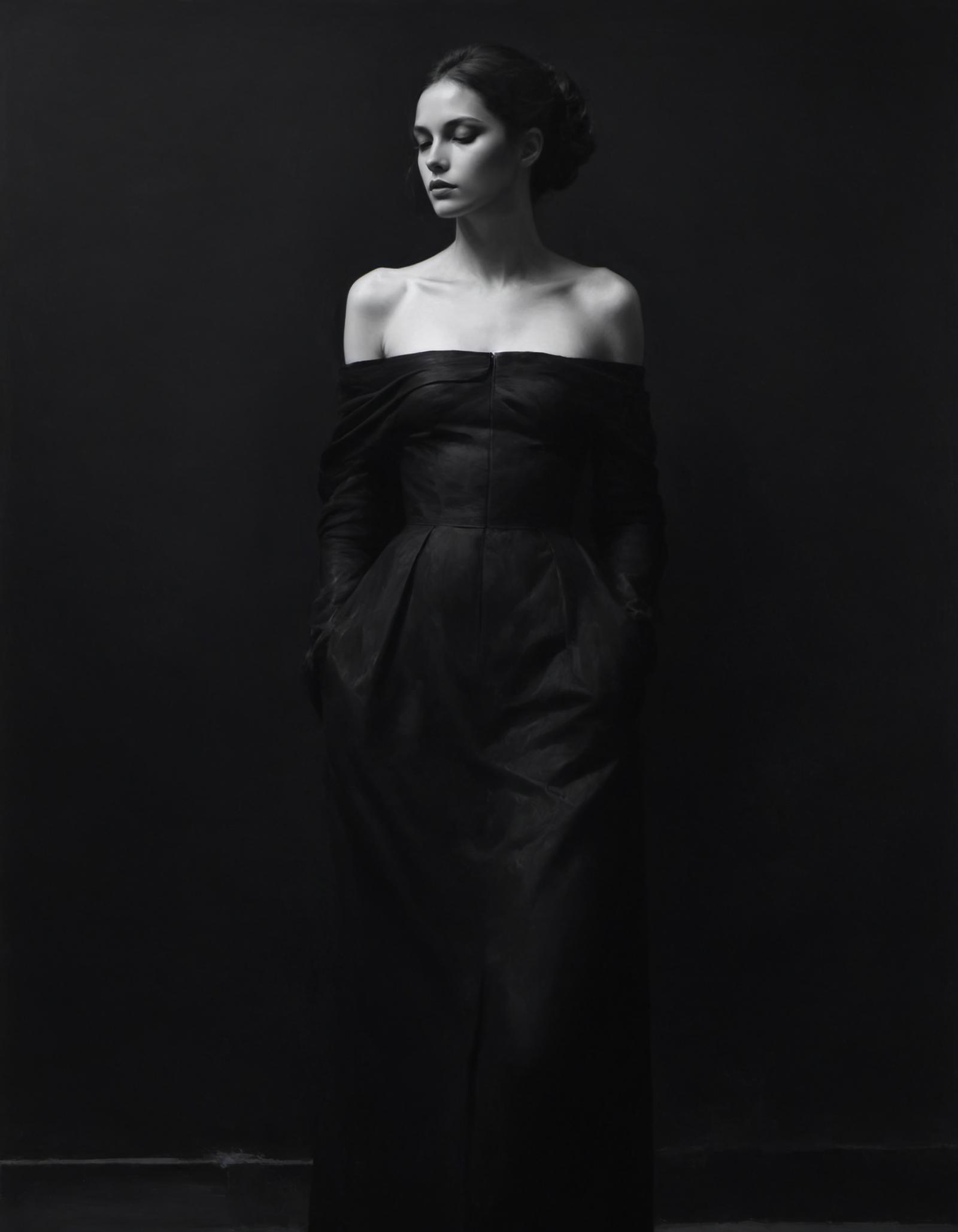 A woman wearing a black dress posing for a portrait.