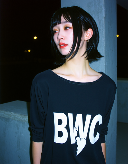 korean woman with very pale skin and black hair and wearing goth dress with the word "BWC" and a broken heart stamped on it in bold white letters and wearing no makeup and no lipstick, looking away, outdoors at night, leaning against concrete wall, candid photo, analog photography with film grain