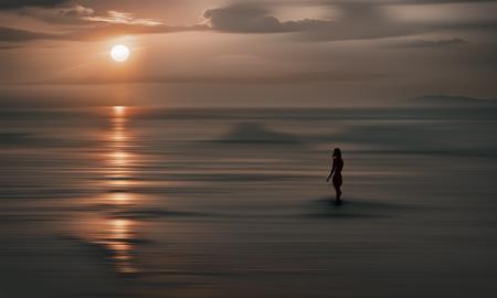 photo of a woman silhouette at sunset