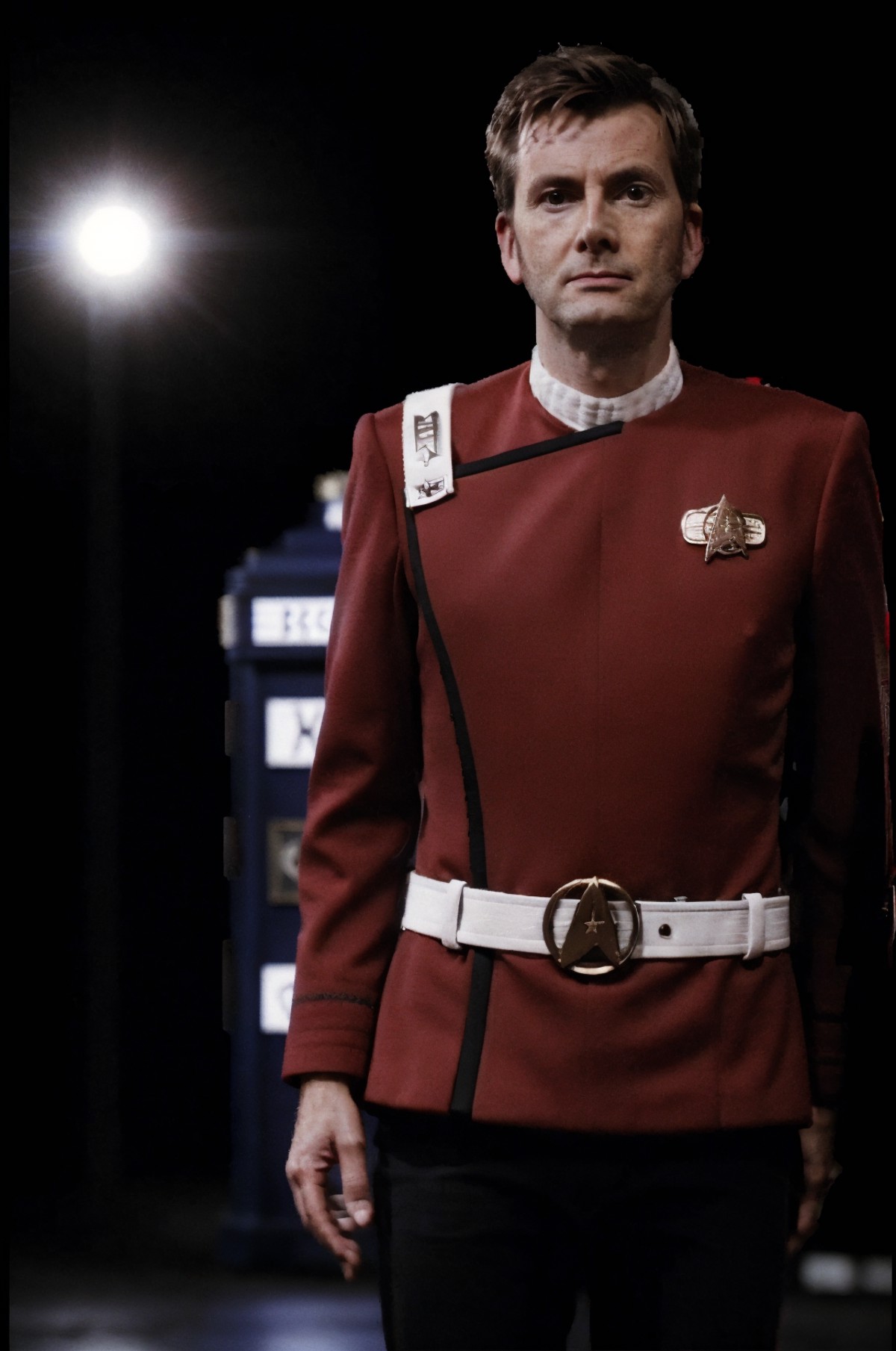 sks person in red  twokunf clothing,street,blue tardis,professional photograph of a stunning man detailed, sharp focus, dr...