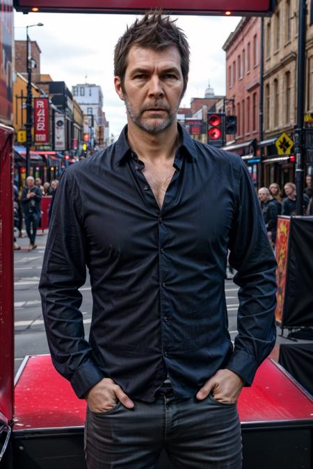 <lora:RhodGilbert:1> rhod gilbert. man with beard standing, on stage, portrait, face, black shirt