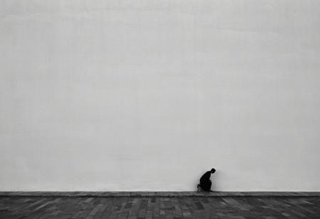 ((in the style of Fan-Ho)). Embark on a journey into the realm of black and white photography to capture a minimalist composition featuring a solitary figure standing on a narrow wall. Utilize the Sony A7IV camera with a 20mm G Master lens set at a wide aperture of F1.5 to achieve minimalist abstraction (1.2), emphasizing the contrast between light and shadow. Against a backdrop characterized by subtle gradients (subtle gradient backdrop: 1.1), evoke a sense of tranquility and introspection (tranquil yet evocative: 1.2). Through conceptual portraiture (1.3), explore the play on perception (play on perception: 1.2) as the figure balances on the wall, symbolizing the delicate equilibrium of life. Infuse the image with surreal calm (surreal calm: 1.1) and utilize visual metaphor (visual metaphor: 1.3) to convey deeper meaning, shot with Canon EOS 5D Mark III, settings at 1/160s, f/8, ISO 100. Elevate the minimalist aesthetic with elements of modern art, incorporating abstract shapes and geometric patterns to create an avant-garde composition that resonates with viewers on a profound level.