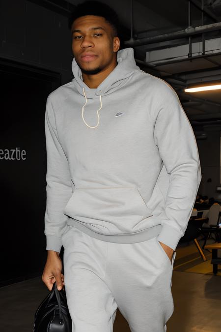 GiannisAntetokounmpo, large format photo of a man, anxious facial expression, gray crewneck sweatshirt, jogger sweatpants and slip-on sneakers, upper body, under bounced lighting, from below, shot on a Kodak Brownie <lora:GiannisAntetokounmpoLora:1>