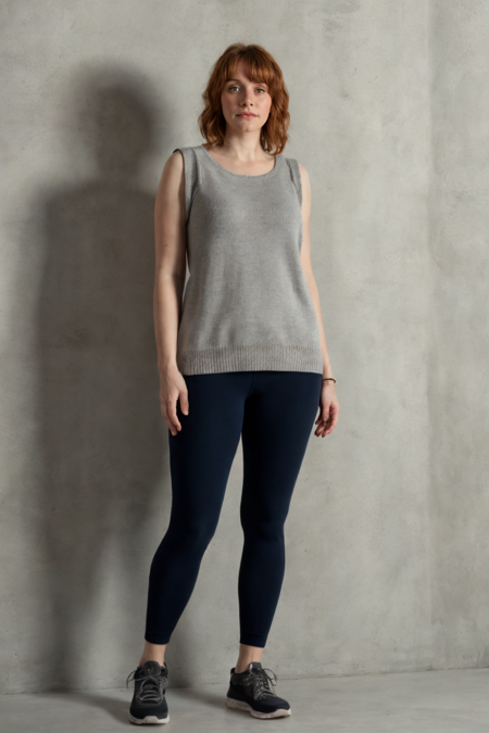 1girl, full body shot, a woman in a sleeveless sweater and gray leggings standing in an empty room, sneakers, simple cement wall in the backdrop, detailed face, (photorealistic, absurdres, best quality, masterpiece:1.4), (high detailed skin:1.3)
 <lora:bdh81_us_lora_v02:1> bdh81