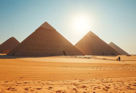 Low angle wide view of ancient Egypt in it's prime, desert, the pyramids are as described by contemporaries: white with limestone and capped with gold, reflecting the strong African sunlight to the point that they are hard to look at
