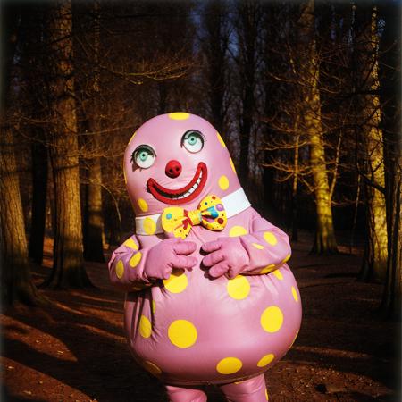 Mr_Blobby, solo, creepy, scary, monster, in the woods, night, dark, atmospheric, low light, horror movie <lora:Mr_Blobby:0.65>  <lora:middleFingerLORA_midfingv1:0.35> middle finger