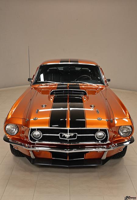 Renaissance style a very nice looking car on display at a show, restomod, mustang, fine fiberglass, orange racing stripes, slick!!, warm shiny colors, muscle cars, fiberglass, polished metal, glossy finish, shining metal, shiny colorful, stunning masterpiece, orange color scheme, high gloss, gloss finish, detailed, classic car, classic chrome,, <lora:Art Brenner CLIP:1>,Art Brenner, . Realistic, perspective, light and shadow, religious or mythological themes, highly detailed