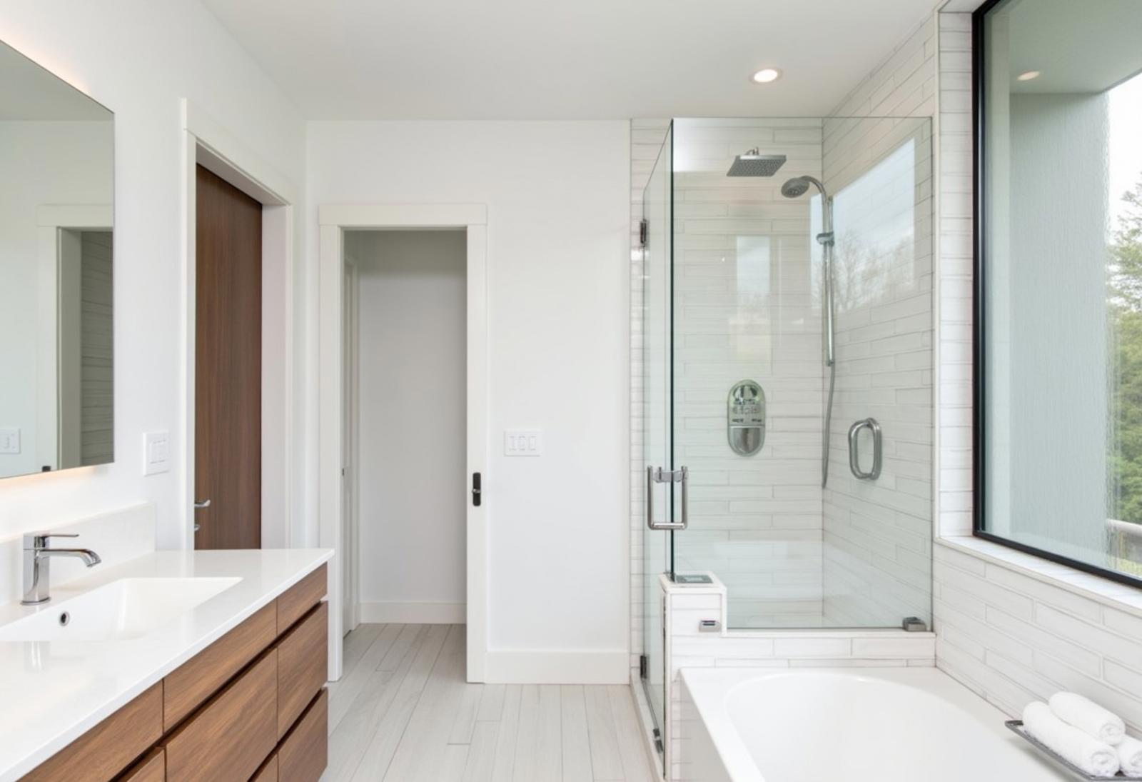 Modern house, white tone, some wood line, glasses door, wide bathroom with nice shower