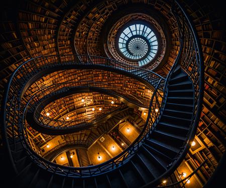 infinite library, multiple floors, spiral staircase seen from above