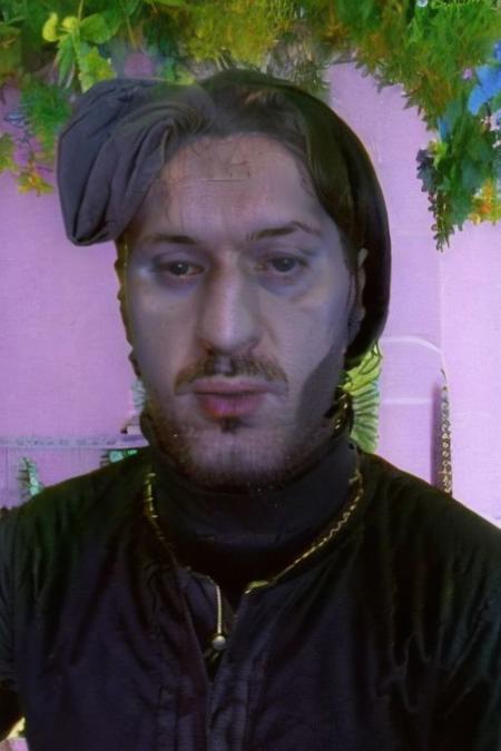 Weirdcore close-up of <ffurian> male character with beard, standing in  pink hills plants, 90VHS, (<ffurian> close-up, in black clothing 1.3),  ffurian looking at viewer (y2k aesthetic 0.8), ms paint style <lora:ms-paint-lora:1> (sunny weather 1.2), the matrix movie, <lora:y2kaesthetic:0.7>, 3d render, lush, bloom, neon, half0ster