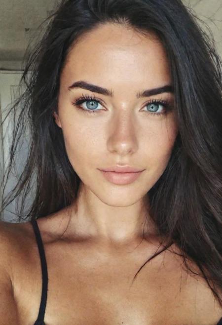 instagram selfie , a 23 year old gorgeous woman , slight smile , detailed skin face and eyes , natural lighting , at home , long hair, topless , film grain, low contrast, natural face , freckles , black hair , blue eyes, dark circles under eyes