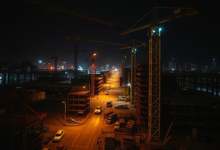 a construction site at night, with complex and intricate movements. Walking alone there is quite terrifying.