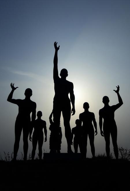 eerie sculpture, faceless human figures, abstract silhouettes, reaching upward, unsettling atmosphere, liminal space, open sky, dreamlike, unsettling, dramatic shadows, minimalist, isolated setting, surrealism, (ominous lighting:1.3), quiet tension, photorealism, high resolution, (liminal:1.5), disturbing mood