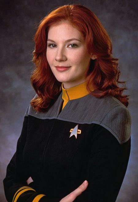 photo of a 20yo ((woman)), red hair, wavy, black and grey ds9st uniform, yellow collar, long sleeves, medium hair, 
<lora:DS9XLVGRAD3:0.8>