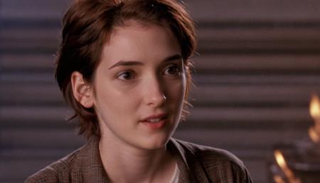 , winona Person finds a mystical bonfire that burns with flames of autumn's richest colors  <lora:Winona Ryder (90s) SDXL - Trigger is Winona Person :1>