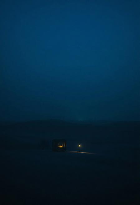 A nostalgic 4K desert scene under a deep königsblau sky — vast dunes cloaked in rich, velvety blue tones. A soft mist clings to the horizon, glowing faintly under the last light. A solitary caravan with faded textiles stands in silence, its lanterns casting cool, diffused reflections on the sand. The wind whispers through distant palm trees. Perfect for a dolly shot — emotional depth, cinematic composition, dreamy textures, One Heart style, ultra-detailed, deep shadows, soft light bloom, melancholic and timeless.foggy