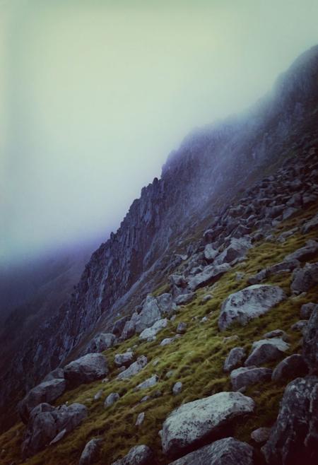 soaked_beer, instagramphoto, a very foggy mountain, dark and creepy, lord of the ring style, hard shadows, film grain