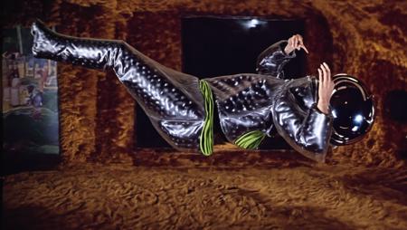 cinematic photo of Barbarella, floating in zero gravity stripping out of (spacesuit), (shagpile background), 35mm photograph, film, bokeh, professional, 4k, highly detailed, full body shot, wide angle