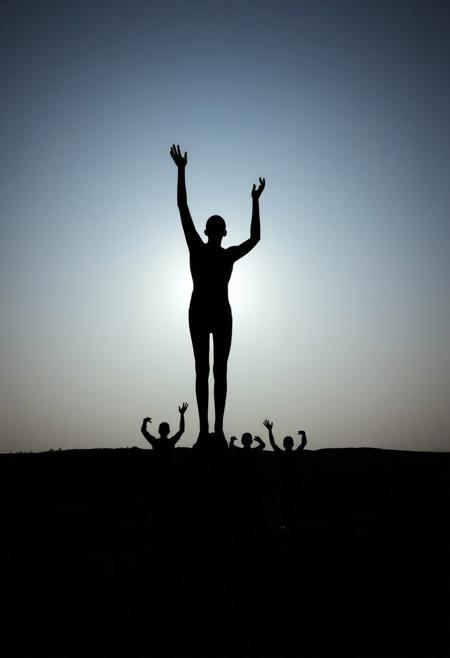 eerie sculpture, faceless human figures, abstract silhouettes, reaching upward, unsettling atmosphere, liminal space, open sky, dreamlike, unsettling, dramatic shadows, minimalist, isolated setting, surrealism, (ominous lighting:1.3), quiet tension, photorealism, high resolution, (liminal:1.5), disturbing mood