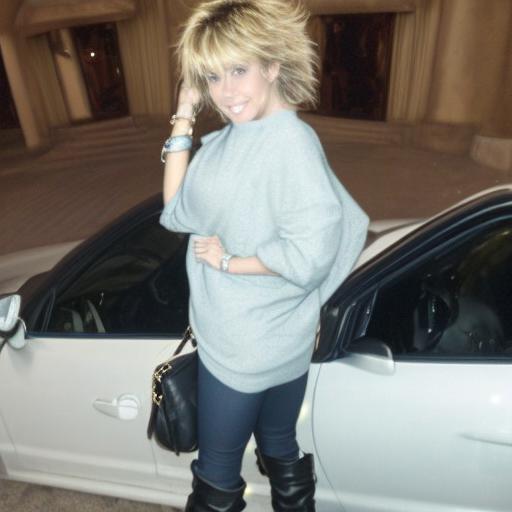 smile, grin, messy hair, bracelet, looking at viewer, short hair, arm support, bag, sweater, looking back, car, 1boy, high heels, boots