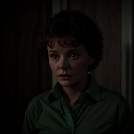 Horror-themed,  <lora:Amanda Bearse SD1.5:1.2>
Amanda Bearse an attractive young woman with a green shirt, Eerie, unsettling, dark, spooky, suspenseful, grim, highly detailed