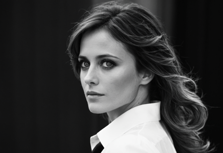 (black and white),  (windy), (pensive), (profile), (full body), looking back over shoulder, eyes looking up, 20 years old, high contrast, shadows,((long)), massive wavy brunette hair, (melancholic),((daydreaming)), unkempt, (wide cheekbones), (round face),  (skin moles), (skin pores), ,(cinematic), bokeh, 32  years old sturdy semitic woman, strong eyebrows, wide cheekbones, big black eyes, white shirt, black tie