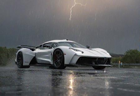 Witness the electrifying spectacle of a hypercar tearing through a rain-soaked racecourse in a stunning display of speed and precision. Against the backdrop of a stormy sky, the sleek silhouette of the hypercar cuts through the deluge with unrivaled intensity.
Every detail of the hyper car is meticulously rendered, from the aerodynamic curves of its body to the gleam of its polished exterior. Raindrops cascade off the car's surface, creating a mesmerizing blur of motion as it hurtles forward with lightning speed., (ultra realistic details),  (UHD)