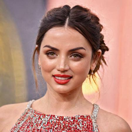 Super high res red carpet event portrait photo skin texture of a ana de armas with a slight smile,f /2.8, Canon, 85mm,cinematic, high quality, skin texture, looking at the camera <lora:ana_xl_8dim-000030:1>