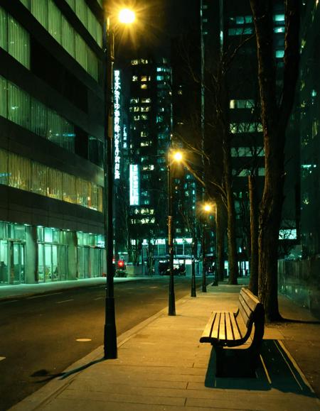 <lora:RokuSignHD:1>,rokusignhd,scenery,building,city,outdoors,cityscape,skyscraper,city lights,, a city street with a few signs on the buildings and a sidewalk with a bench on it and a light on [1]