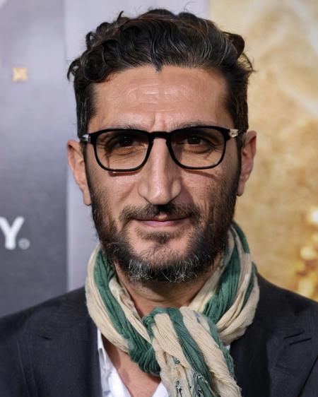 <lora:Fares_Fares:0.8> (Fares Fares:1.3), portrait photo of a man, front view, on a movie premiere, happy, messy medium length hair, age:50, scarf, glasses, skin detail, natural lighting sunlight, 4k uhd, dslr, soft light, high quality, Fujifilm XT3, long beard, closed mouth, lips, (beautiful eyes, iris, pupil:1.1), face birthmark