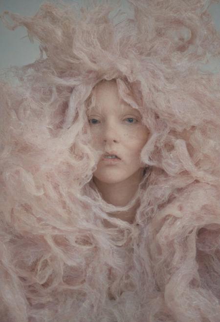 Portrait of a woman, with lush hair with voluminous shapes made of plastic noodles, surreal style, mix of natural and artificial, pastel tones, detailed hyperrealistic, 4K