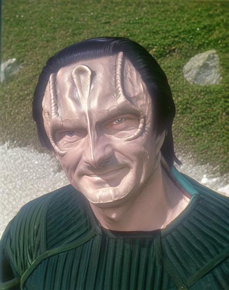 cardassian, male, garak, grey skin, black slicked back hair, reptile scales on sides of neck, wearing dark green black outfit, slight smile, andrew robinson, (medium shot:1.1), (portrait:1.1), head and shoulders portrait, at the beach, outdoors, perfect sunny day, highly detailed face, perfecteyes eyes, 8k, photograph, film still, 35mm photo, Canon F-1, film grain, <lora:cardassian_lora:0.8>, <lyco:locon_perfecteyes_v1_from_v1_64_32:0.5>