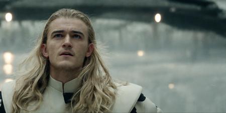 A photo of  [orlandobloom] ((wearing a white space admirals uniform)), (((curly blonde hair))) on a spaceship bridge, dynamic pose, rim lighting, dramatic lighting, bokeh, actionhelper, aslanscifi-v1, (DaveSpaceFour)